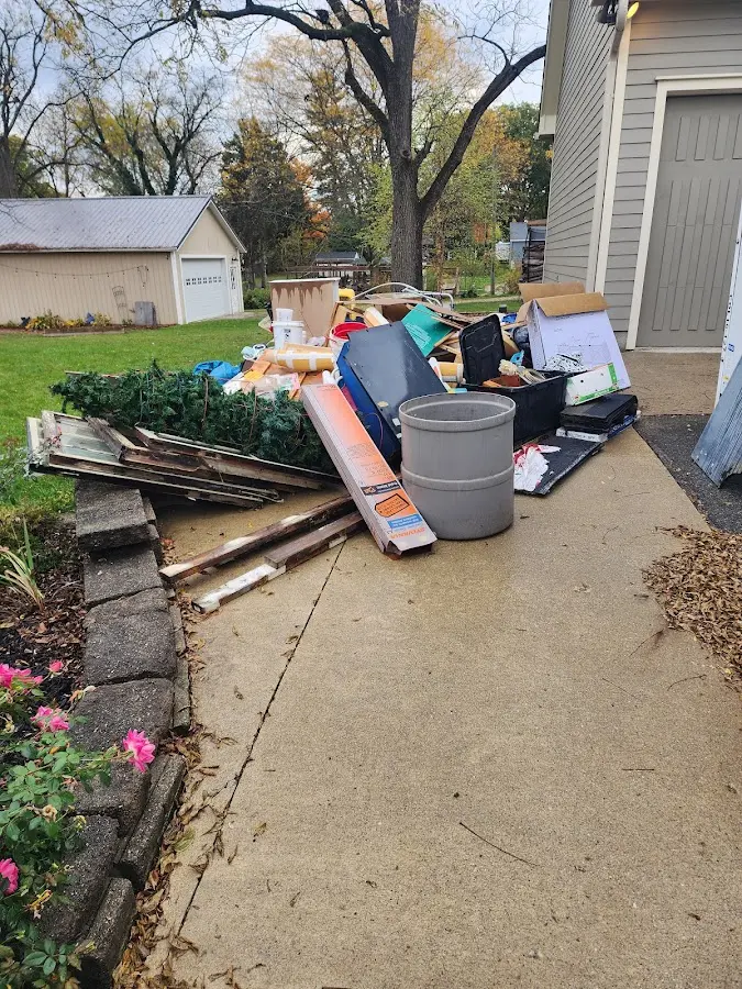 Dumpster being loaded with debris for Demolition Dumpster Rental in Woodfield